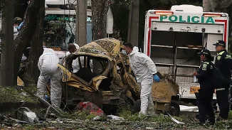 COLOMBIA: 17 muertos en atentados con coche bomba y derribo de helicóptero